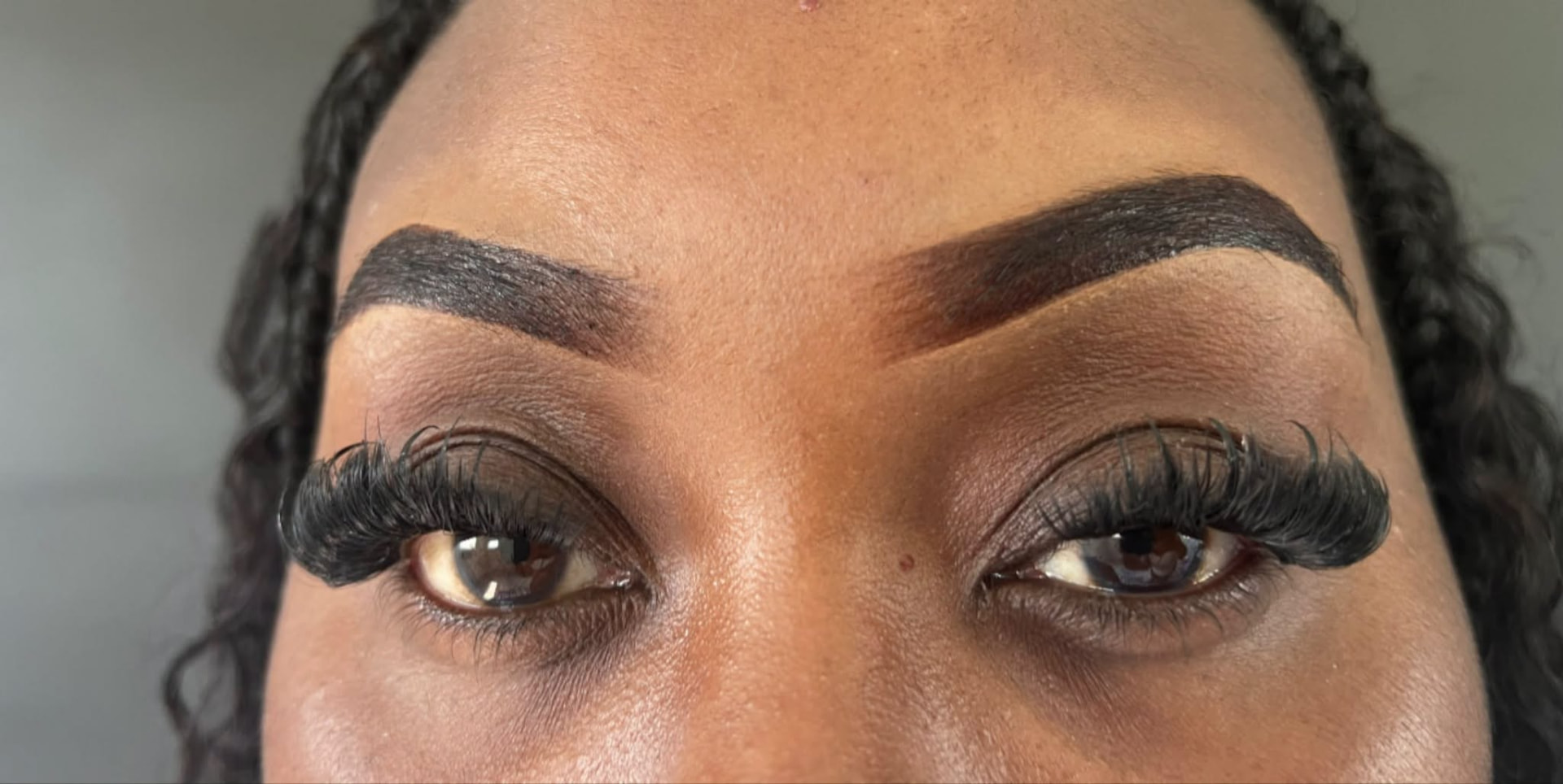 Tinted brows paired with cluster lashes